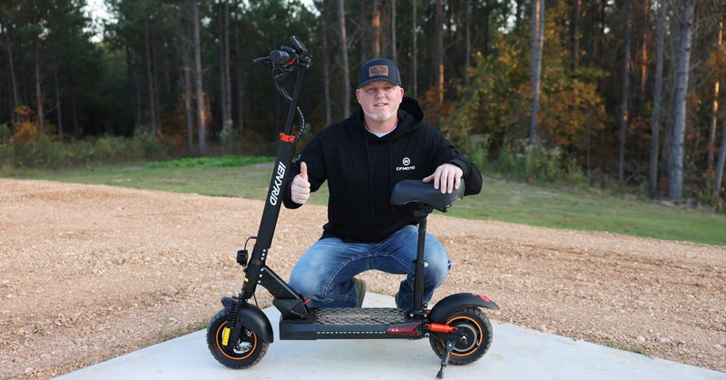 A man with his iENYRID M4 Pro s+ 2024 electric scooter